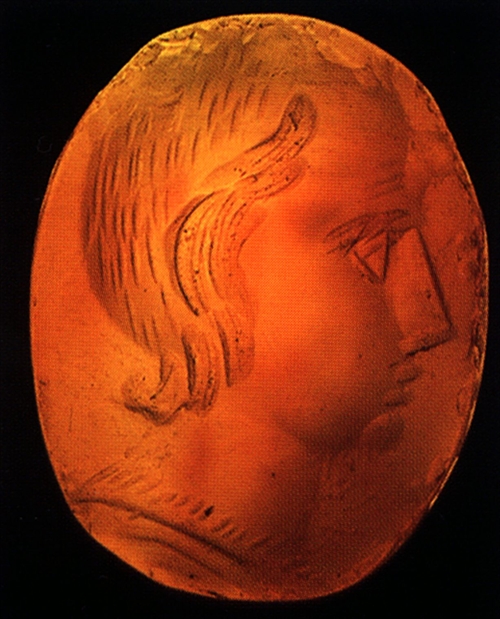 Geme from carneol with the image of young boy with Horus lock